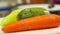 vegetables zucchini carrots pepper on white cutting board in kitchen