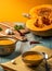 Vegetarian autumn pumpkin cream soup. Pumpkin soup with spices on a wooden table