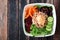 Vegetarian buddha bowl on a dark wood background