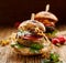 Vegetarian burger, green peas burger, homemade burger with green peas cutlet, grilled mushrooms, tomato, red onion, lamb`s lettuce