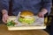 Vegetarian Burger with potato cutlet, salad and sauce on wooden board