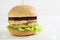 Vegetarian Burger with vegetable cutlet, hummus, beetroot on a white wooden background