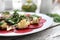 Vegetarian carpaccio of roasted beetroot with cauliflower and green salad