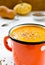 Vegetarian carrot-pumpkin cream soup with flax seeds