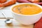 Vegetarian carrot-pumpkin cream soup with garlic and cumin