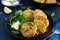 Vegetarian chickpeas and spinach fritters with garlic herb yogu