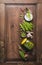 Vegetarian concept. Fresh garden peas canning in pods in glass jar with seasonings on a rustic wooden table, top view. Vegetables