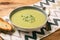 Vegetarian cream soup with leek, potatoes and green pea.