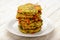 Vegetarian cuisine - vegetable fritters (with potatoes, carrot, zucchini, paprika and parsley).