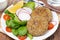 Vegetarian cutlets with fresh salad on the plate