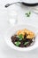 Vegetarian dinner table. Black quinoa, oatmeal cutlets with prunes