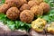 Vegetarian dish - falafel balls from spiced chickpeas on wooden rustic table