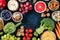 Vegetarian food background design with copy space, a flatlay, shot from above. Fruit and vegetables, cheese, nuts, rice