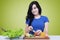 Vegetarian girl cutting vegetable