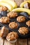 Vegetarian homemade banana walnuts muffins close-up in a baking dish. vertical