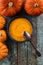 Vegetarian homemade pumpkin soup decorated with bright orange pu