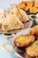 Vegetarian indian food or starters on metal plates including samosa