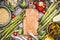 Vegetarian ingredients for pearl barley porridge or salad around wooden cutting board, top view. Healthy clean food