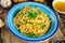 Vegetarian Italian Pasta Spaghetti Aglio E Olio with garlic bread, red chili flake, parsley, parmesan cheese and glas on