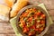 Vegetarian Moroccan Taktouka salad of pepper and tomato close-up in a plate. horizontal top view