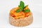 Vegetarian oatmeal porridge with organic dried apricots and mint leafs