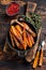 Vegetarian Oven baked sweet potato fries. Dark wooden background. Top view