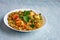 Vegetarian paneer biryani at light blue background