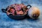 Vegetarian pile of healthy beet chips Purple Baked Beet Chips Vegan snacks, vegetable chips in canvas bag and ceramic bowl, rustic