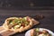 Vegetarian pizza with vegetables on roman dough, pinsa. on a dark wooden background. rustic. recipe