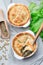 Vegetarian pot pie with lentil, mushroom, potato, carrot and green peas, covered with puff pastry, in a baking dish, vertical, top