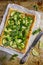 Vegetarian puff pie with zucchini, broccoli and green peas.