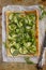Vegetarian puff pie with zucchini, broccoli and green peas.