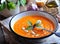 Vegetarian pumpkin soup with garlic, basil and olive oil