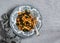 Vegetarian rigatoni pasta with chickpeas, spinach and olives in a tomato sauce on a light background