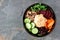 Vegetarian salad bowl on a slate background