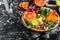 Vegetarian salad. Clean healthy eating concept. Buddha bowl with avocado, blood orange, broccoli, watermelon radish, spinach,