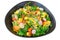 Vegetarian salad with radish, arugula, pineapple and tomatoes isolated on white background