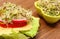 Vegetarian sandwich and bowl with alfalfa and radish sprouts