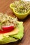 Vegetarian sandwich and bowl with alfalfa and radish sprouts