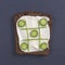 Vegetarian sandwiches with cream cheese, cucumbers and parsley, healthy snack on black slate background, top view. Tic Tac Toe gam