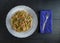 Vegetarian Schezwan Noodles or Vegetable Hakka Noodles or Chow Mein in white plate at wooden background. Schezwan Noodles is indo-