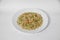 Vegetarian Schezwan Noodles or Vegetable Hakka Noodles or Chow Mein in white plate at wooden background. Schezwan Noodles is indo-