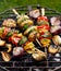 Vegetarian skewers, grilled vegetable skewers of zucchini, peppers and potatoes with the addition of aromatic herbs and olive oil