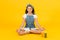 Vegetarian smoothie drink. Yoga training. KId girl sit meditate. Meditating practice. Good vibes. Peaceful meditating