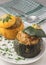 Vegetarian stuffed round zucchinis with vegetables, close up view. Served and ready to eat.