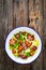 Vegetarian style caesar salad on wooden background