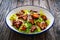 Vegetarian style caesar salad on wooden background