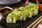 Vegetarian sushi rolls avocado with cream Philadelphia cheese, sesame, unagi sauce.