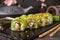 Vegetarian sushi rolls avocado with cream Philadelphia cheese, sesame, unagi sauce.