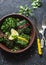 Vegetarian swiss chard packets. Chard leaves stuffed with lentils and garden vegetables on a dark background, top view. Vegetaria